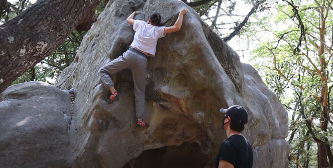 jenn sends on a V1 oudoor boulder that more closely resembles a V3 or V4 indoor boulder