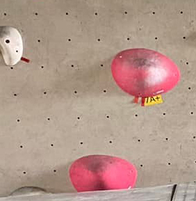 example of a bouldering gym that uses labels to grade their boulder problems