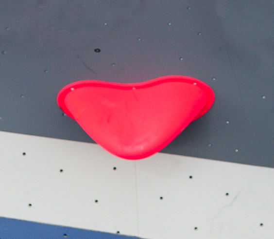example of a sloper hold at an indoor bouldering gym