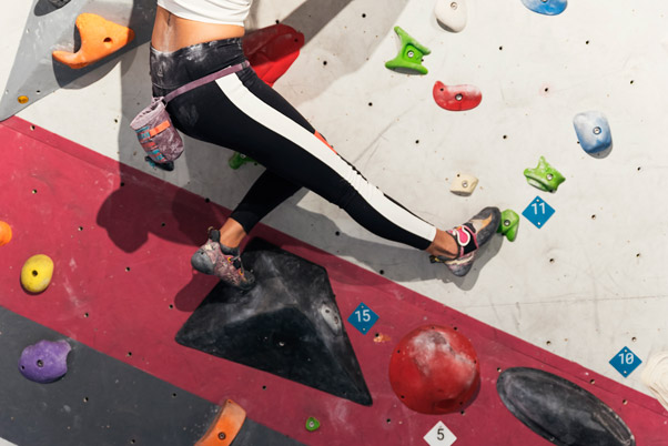 a climber smearing on a volume at the indoor bouldering gym
